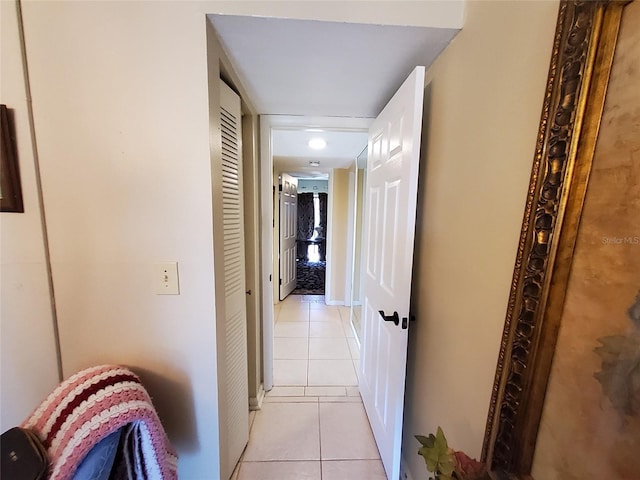 hallway featuring light tile patterned floors