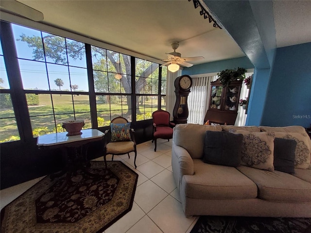 sunroom with a ceiling fan