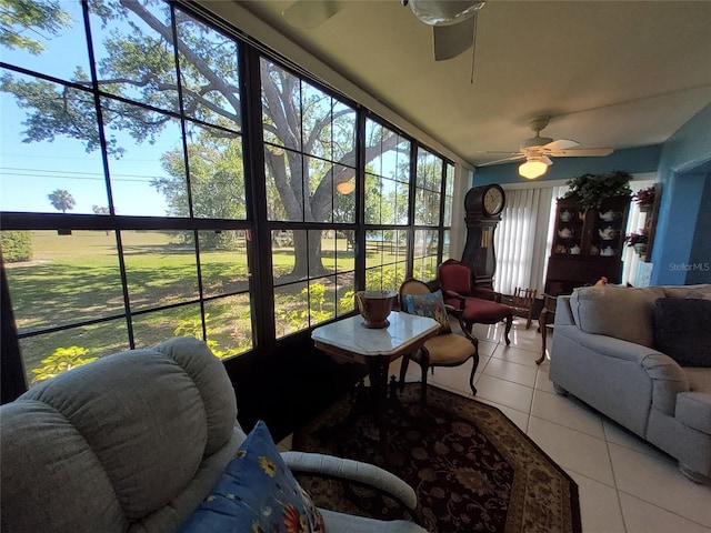 sunroom featuring ceiling fan