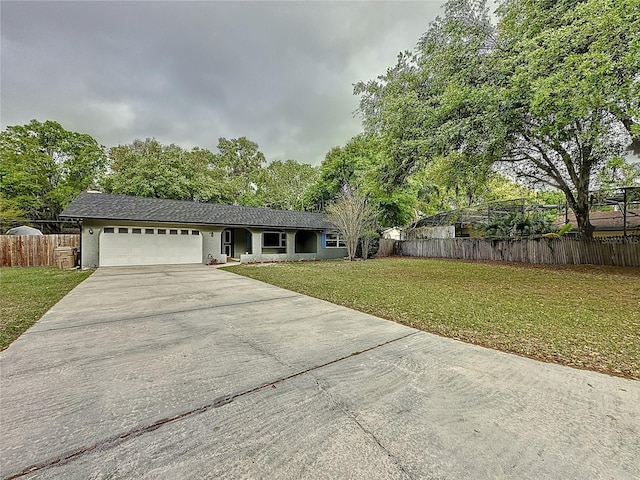 876 Lobster Ct, Kissimmee, FL 34744 - ranch-style home featuring concrete driveway, a garage, fence, and a front yard