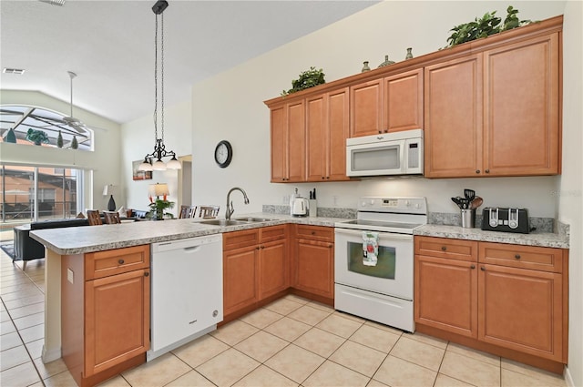 kitchen featuring a sink, white appliances, a peninsula, and light countertops