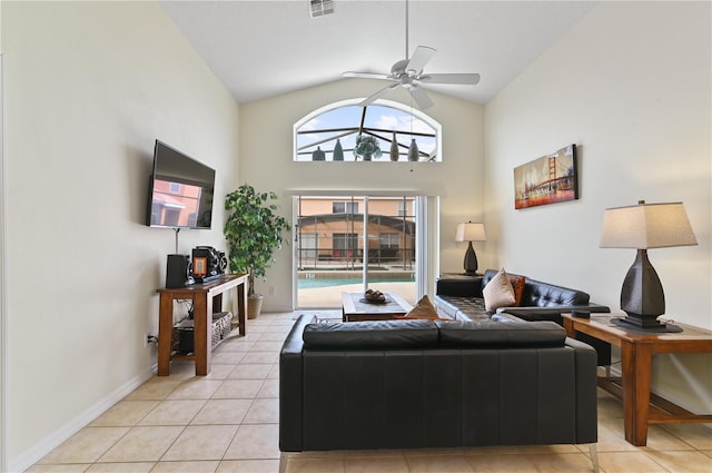 living room with visible vents, baseboards, high vaulted ceiling, light tile patterned flooring, and ceiling fan