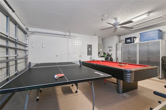 rec room with concrete floors, electric panel, water heater, a garage, and a ceiling fan