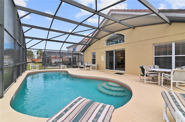 outdoor pool featuring a patio and a lanai