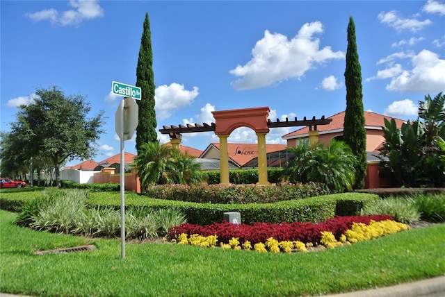 community sign featuring a lawn