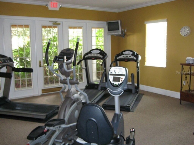 exercise room featuring french doors, baseboards, carpet floors, and crown molding