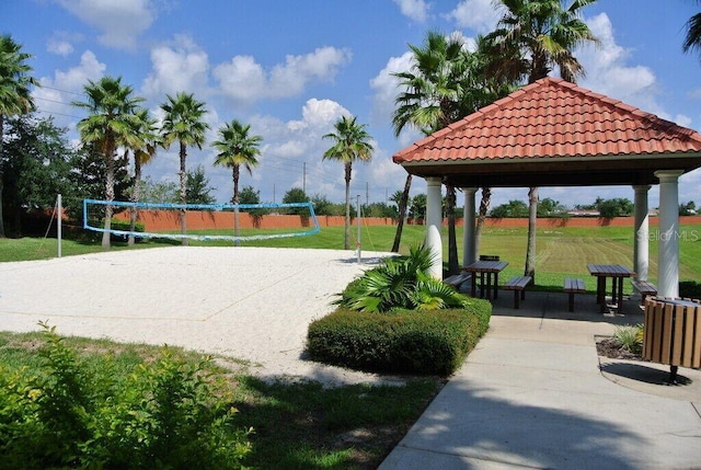 view of community with a gazebo, a yard, and volleyball court