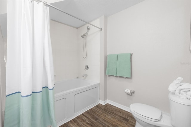 bathroom with toilet, shower / tub combo, baseboards, and wood finished floors