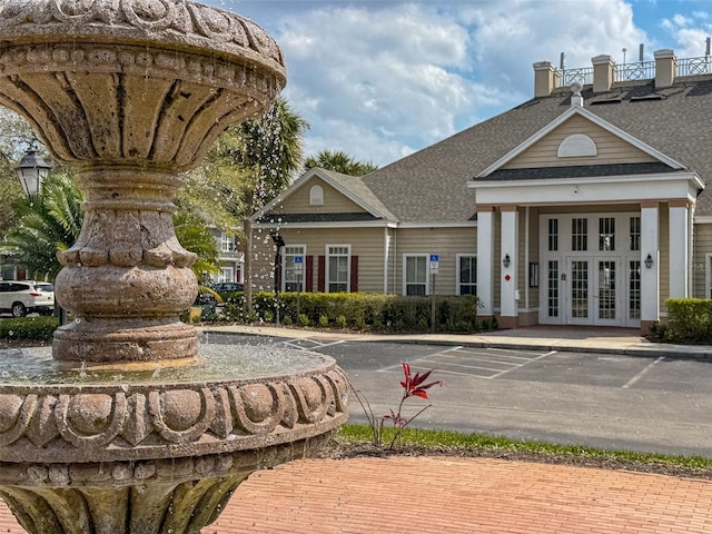 view of building exterior with uncovered parking