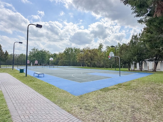 view of sport court featuring community basketball court and a lawn