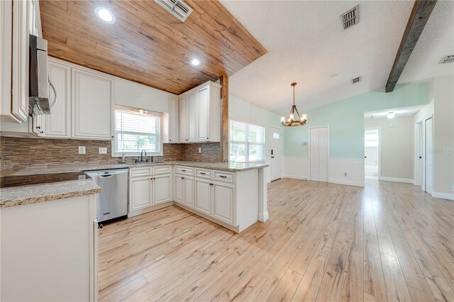 kitchen featuring light wood-type flooring, visible vents, stainless steel dishwasher, and vaulted ceiling with beams