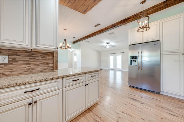 kitchen featuring tasteful backsplash, light wood finished floors, stainless steel fridge with ice dispenser, beamed ceiling, and french doors