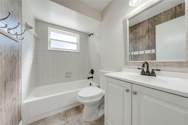 full bath with tile patterned floors, toilet, shower / washtub combination, and vanity