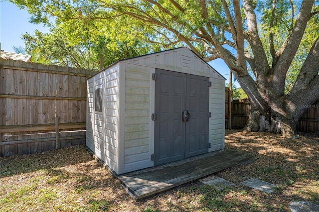 view of shed with a fenced backyard