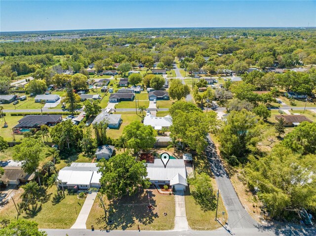 drone / aerial view featuring a wooded view