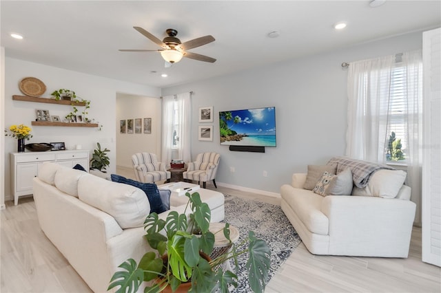 living room with recessed lighting, baseboards, a wealth of natural light, and ceiling fan