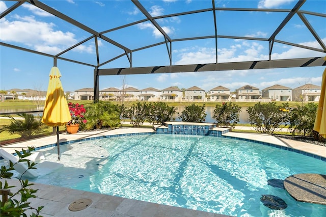 pool with a patio area, a residential view, and glass enclosure