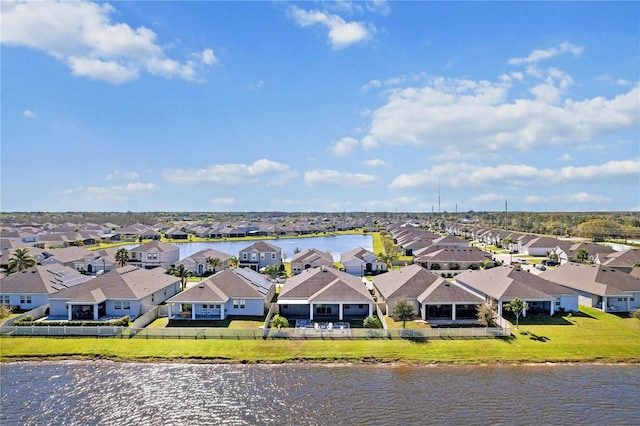 birds eye view of property featuring a residential view and a water view