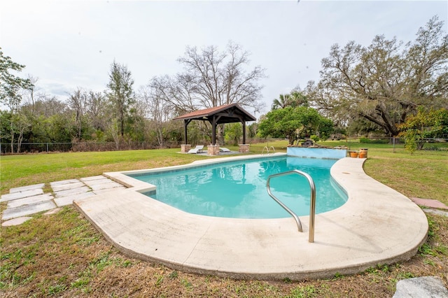 view of pool with a gazebo, a yard, and fence