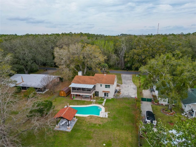 drone / aerial view featuring a forest view