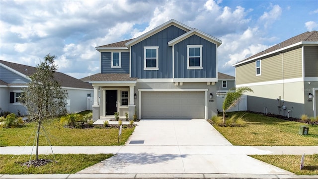 view of front of property featuring stucco siding, concrete driveway, a front lawn, a garage, and board and batten siding