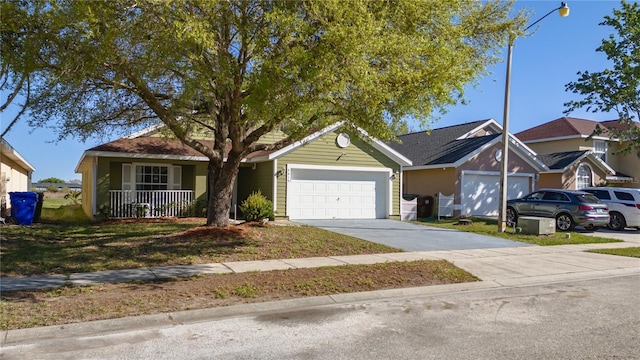 ranch-style house featuring covered porch, concrete driveway, and a garage