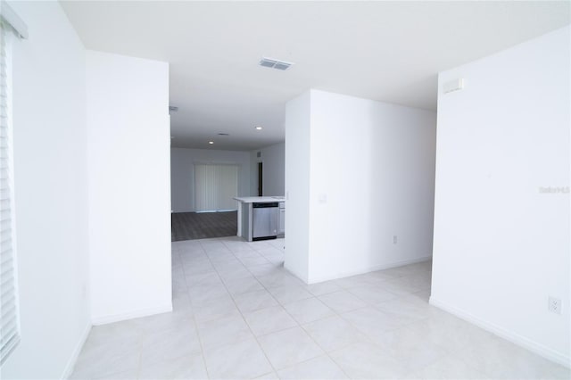 unfurnished room featuring recessed lighting, baseboards, and visible vents