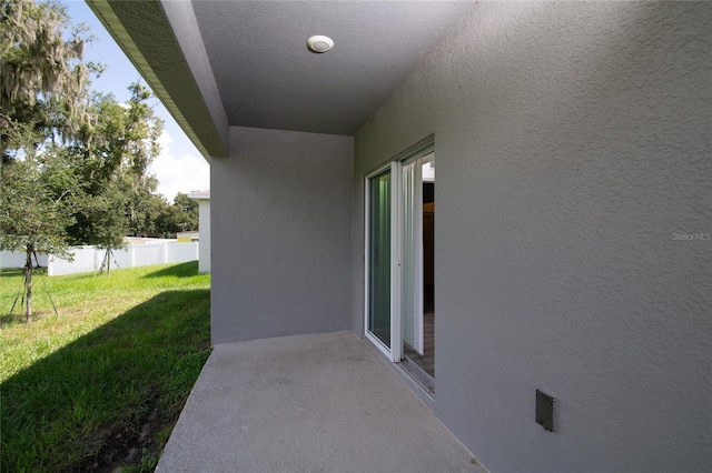 view of patio featuring fence