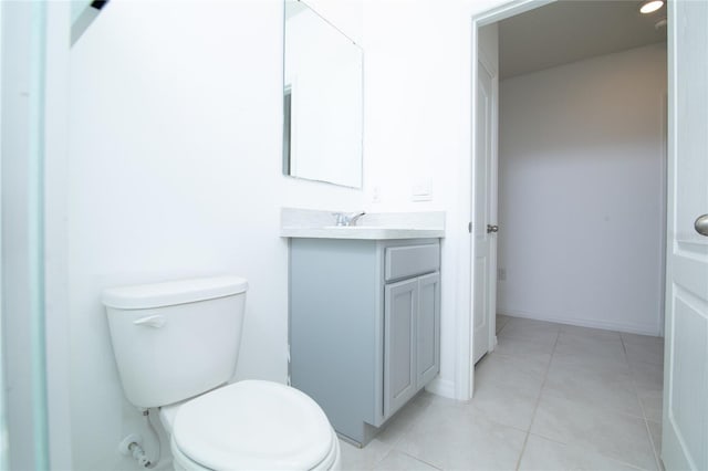 bathroom with vanity, tile patterned floors, and toilet