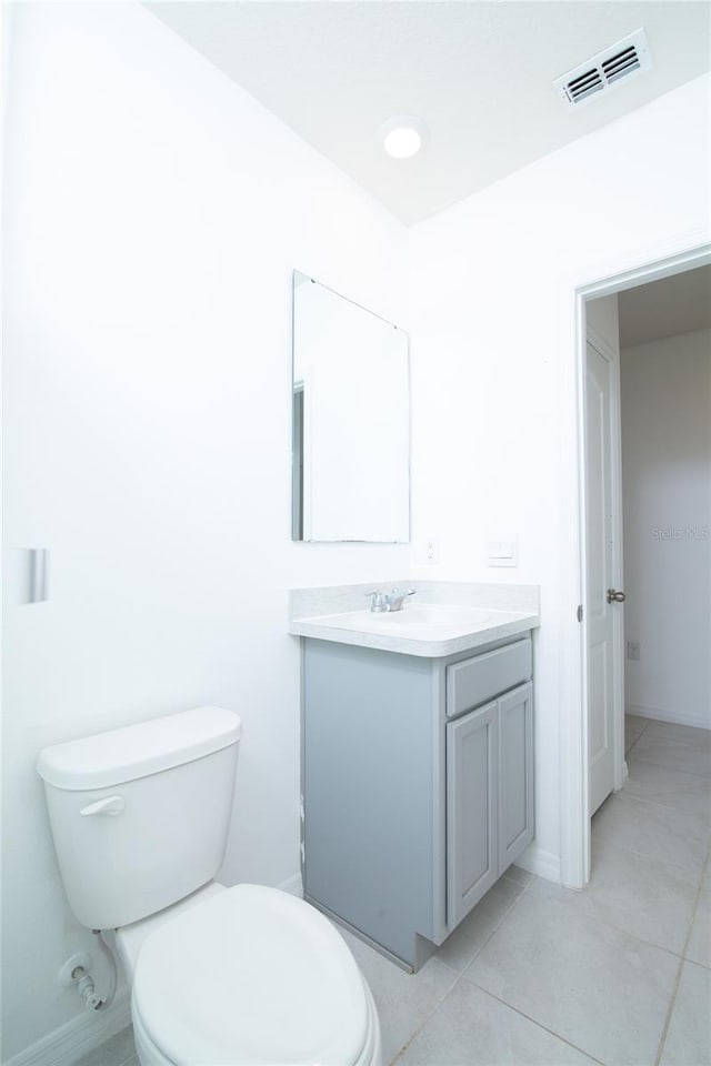 bathroom featuring visible vents, toilet, recessed lighting, tile patterned floors, and vanity