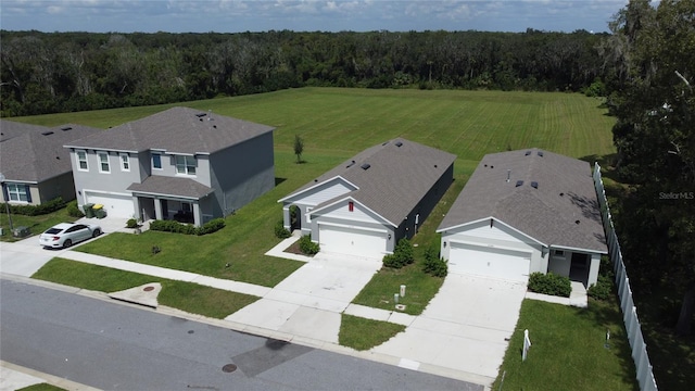 aerial view featuring a wooded view