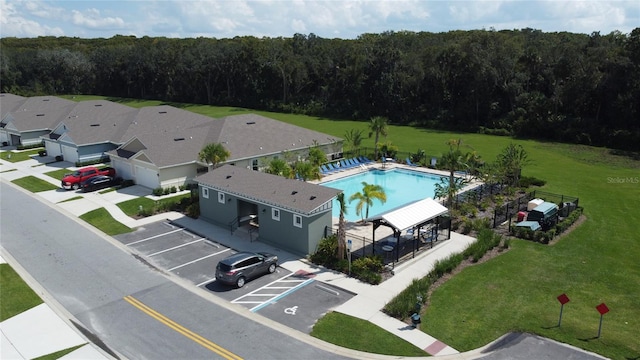 birds eye view of property with a forest view