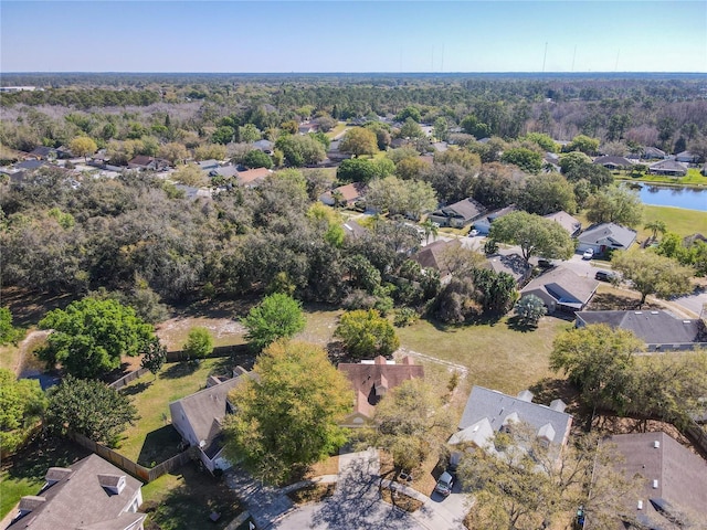 drone / aerial view with a residential view and a water view