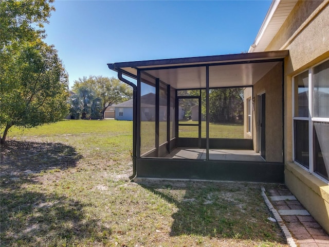 view of yard featuring a sunroom