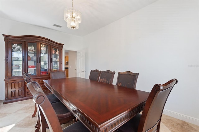 dining room featuring visible vents, baseboards, and a chandelier