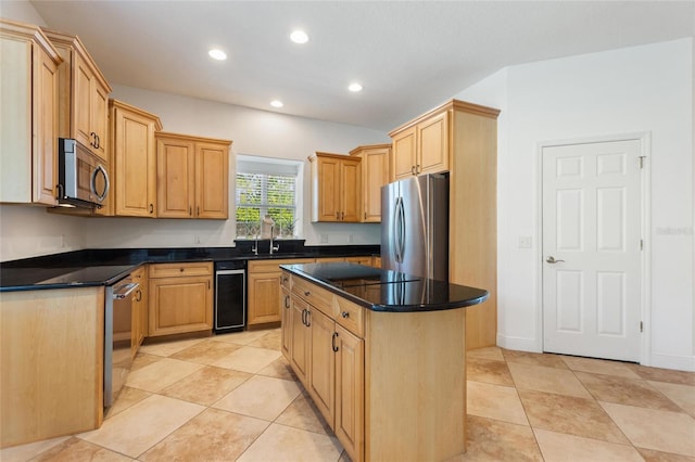 kitchen featuring dark countertops, a kitchen island, recessed lighting, and stainless steel appliances