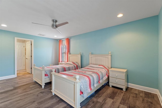 bedroom featuring a ceiling fan, wood finished floors, visible vents, and baseboards