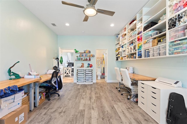 office featuring visible vents, a ceiling fan, recessed lighting, light wood-style floors, and baseboards