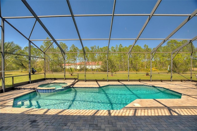 view of swimming pool featuring glass enclosure, a pool with connected hot tub, and a patio