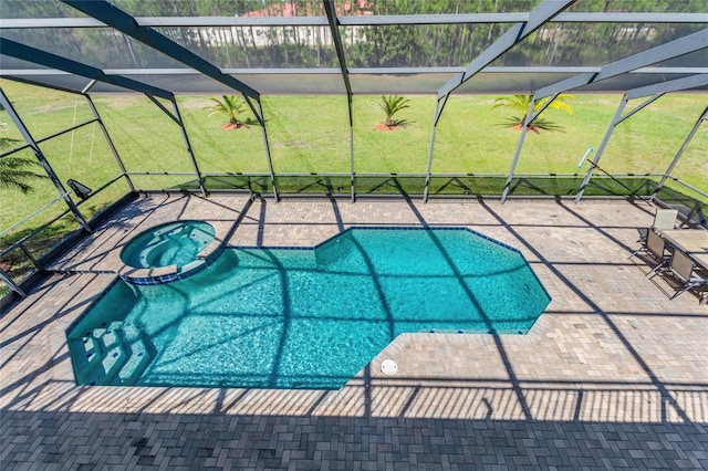 view of swimming pool featuring glass enclosure, a patio, a yard, and a pool with connected hot tub