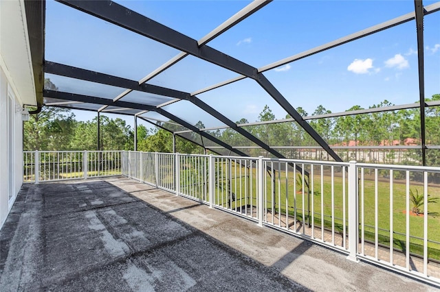 view of patio with glass enclosure