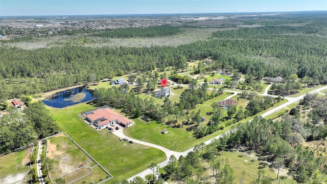 bird's eye view with a view of trees and a water view