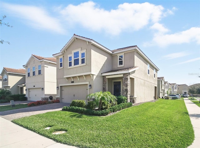 view of front of home with stucco siding, driveway, a front lawn, a residential view, and an attached garage