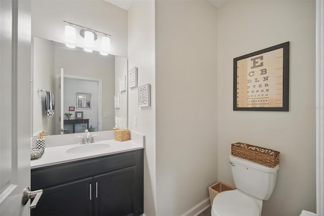 bathroom with toilet and vanity