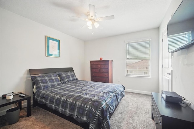 bedroom featuring carpet flooring, a ceiling fan, and baseboards