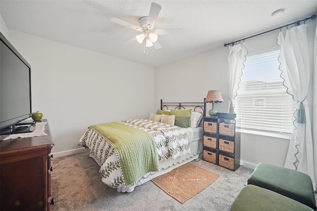 bedroom featuring baseboards, carpet floors, and ceiling fan