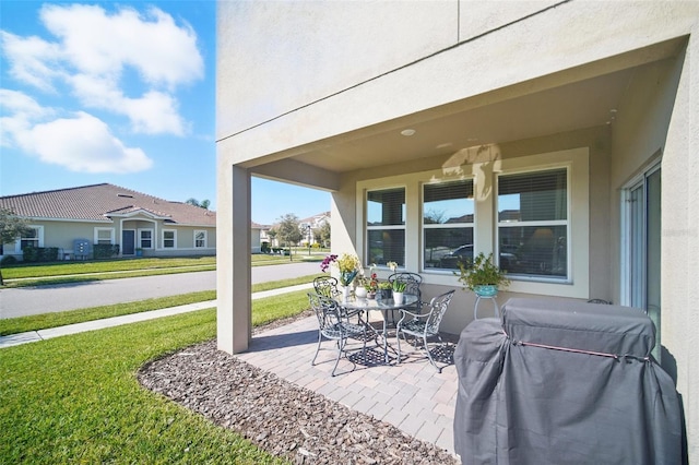 view of patio featuring a grill