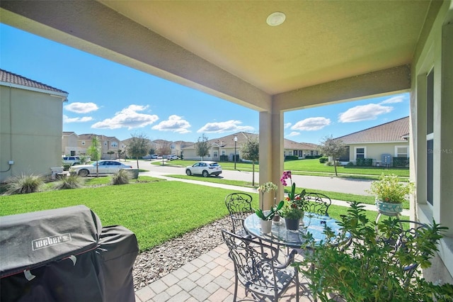 view of patio / terrace featuring a residential view and area for grilling