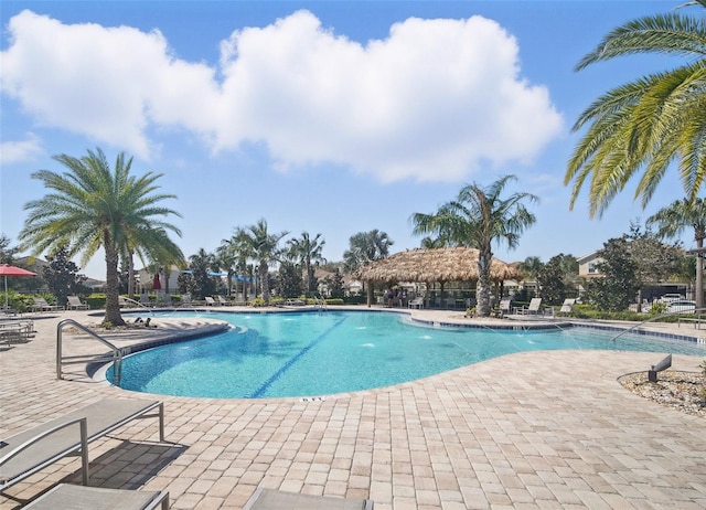 community pool with a patio area