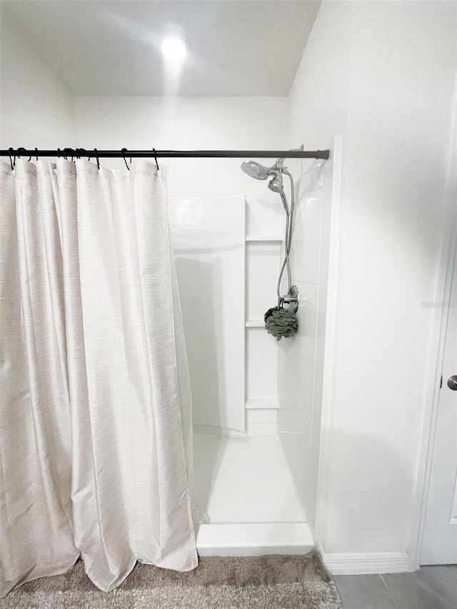 bathroom with a shower with curtain